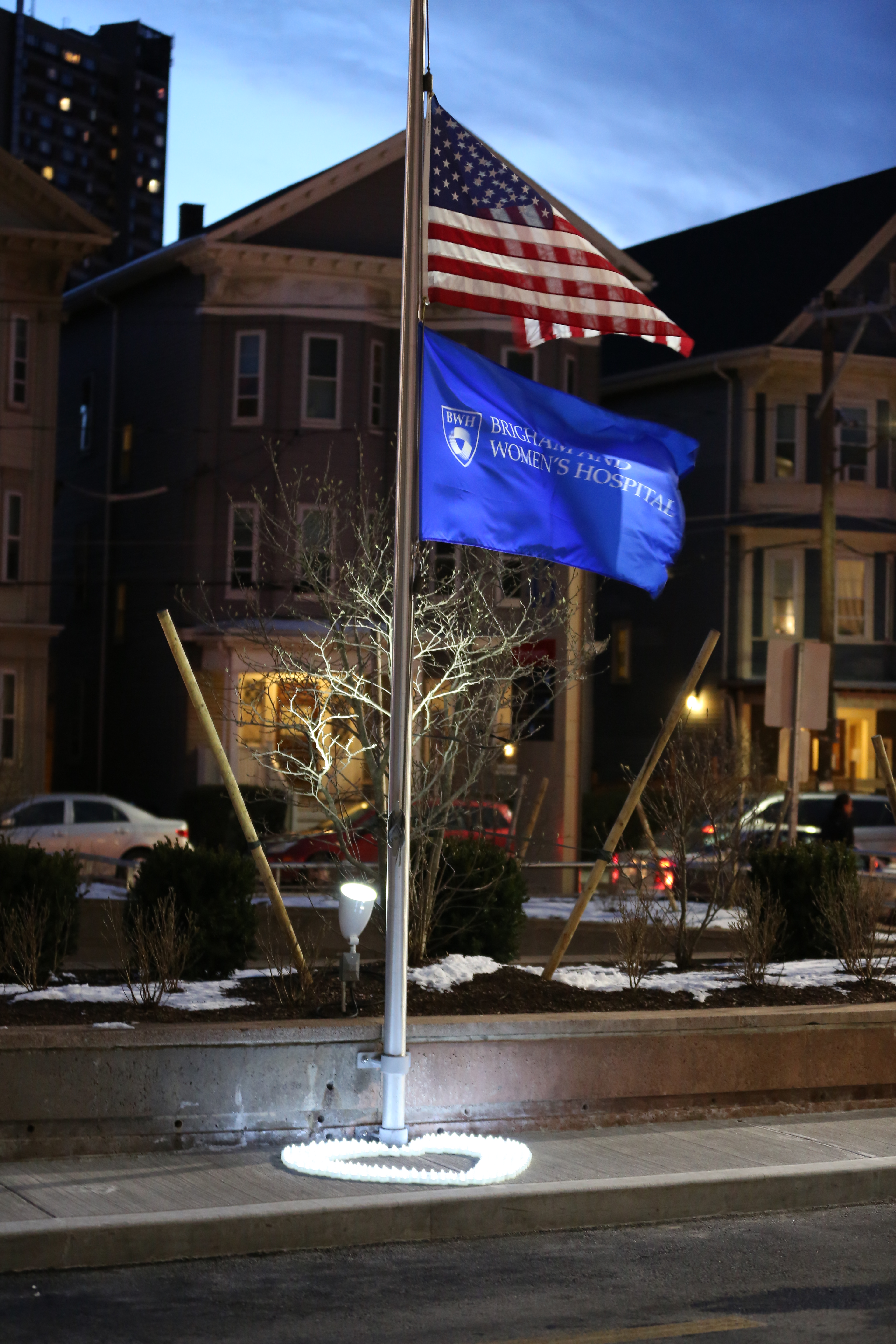 The flags outside 45 Francis St., lit by electric candles on the evening of Jan. 20