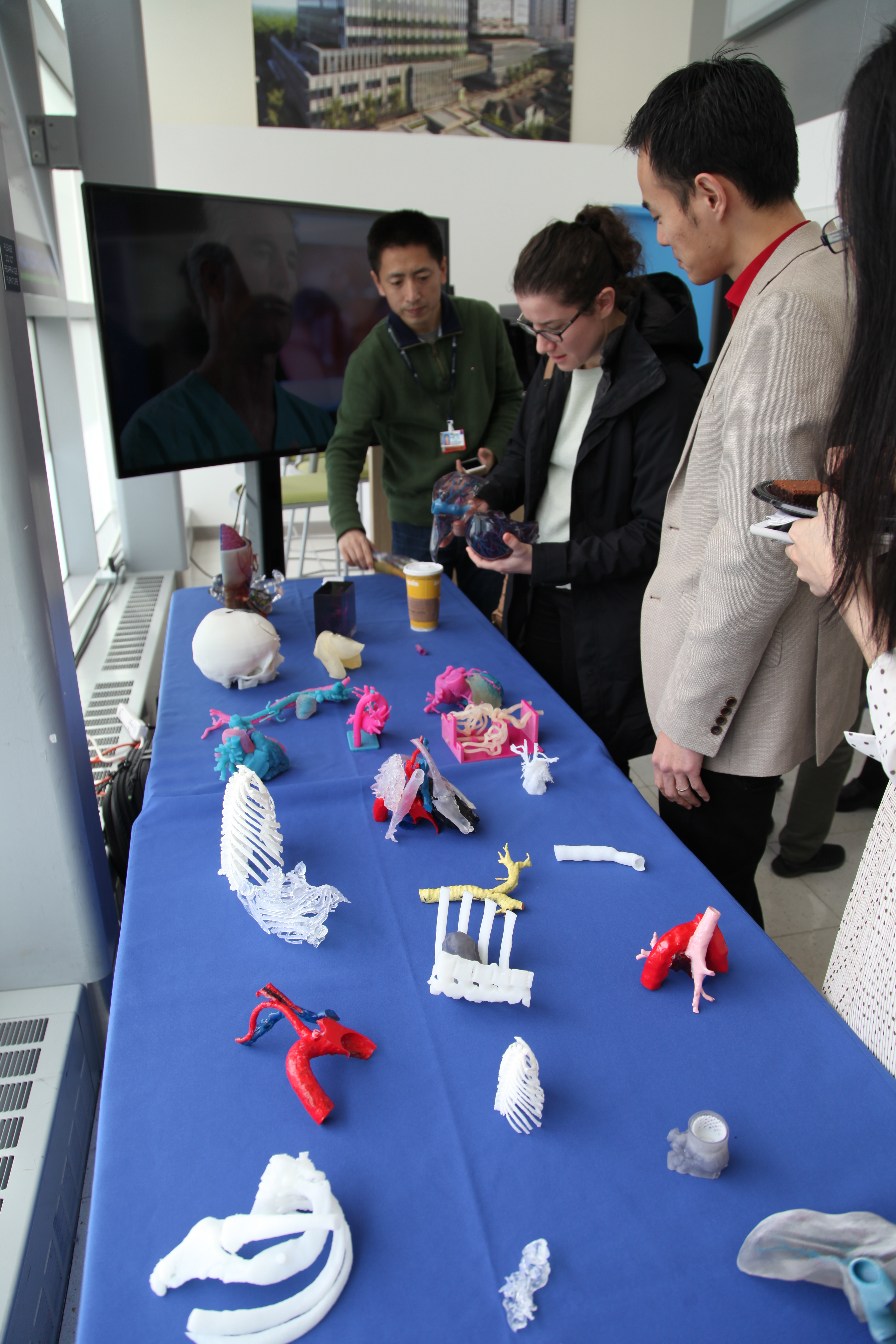 3-D Printing in Healthcare Fair attendees take a look at 3-D printed models after the event.