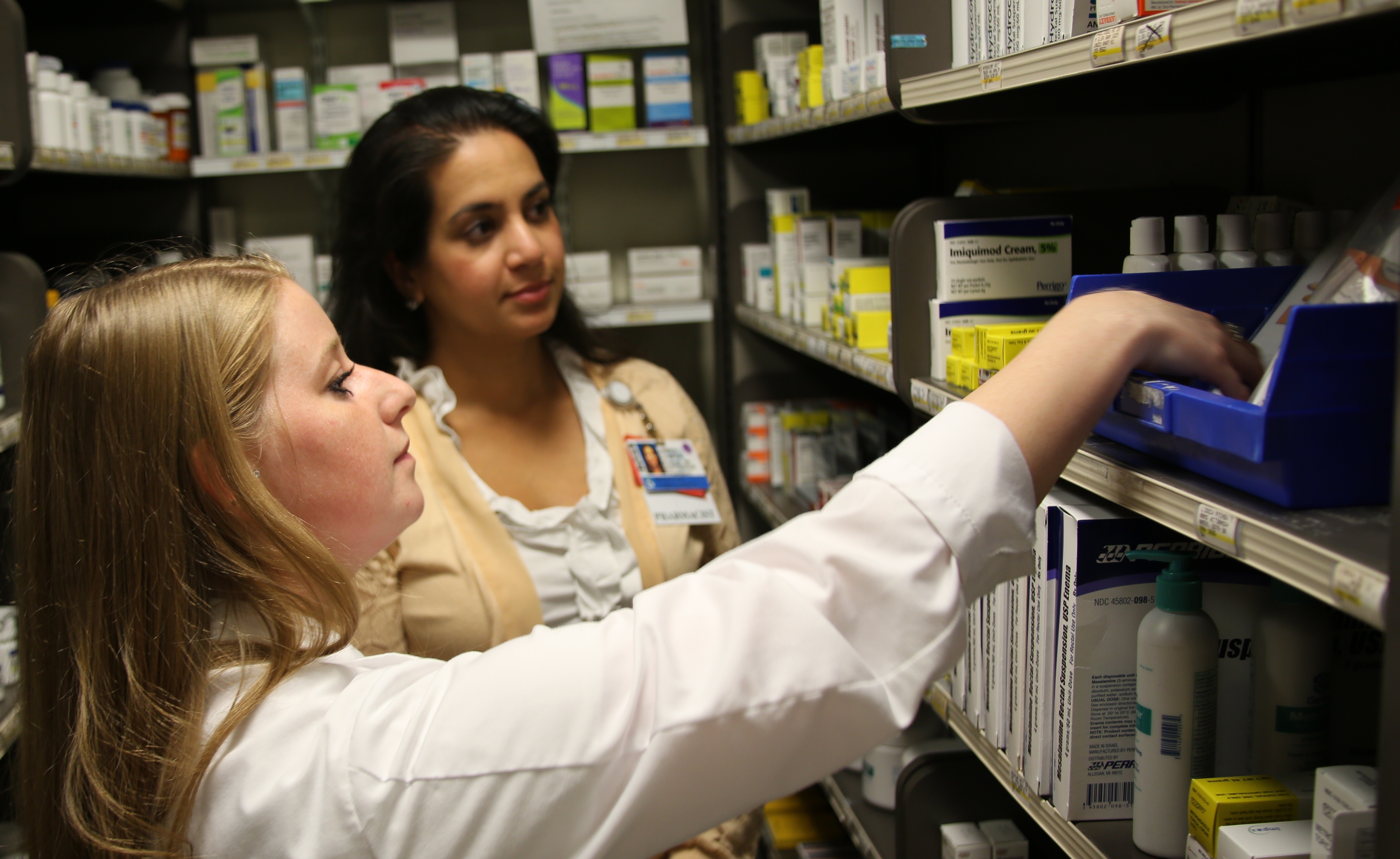 From left: Pharmacists Jayme Boutilier and Amrita Chabria review naxolone inventory in the Outpatient Pharmacy.