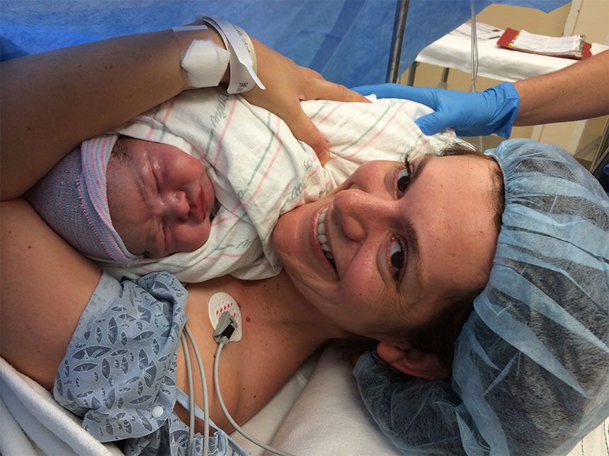 Vesela Kovacheva snuggles with her oldest daughter, Kalina, moments after her birth at the Brigham.