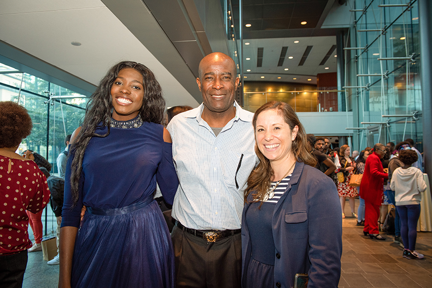 From left: SSJP Student President Thenicha Bruny celebrates with her father, Paul Bruny, and her Brigham mentor, Caitlyn DeCastro.