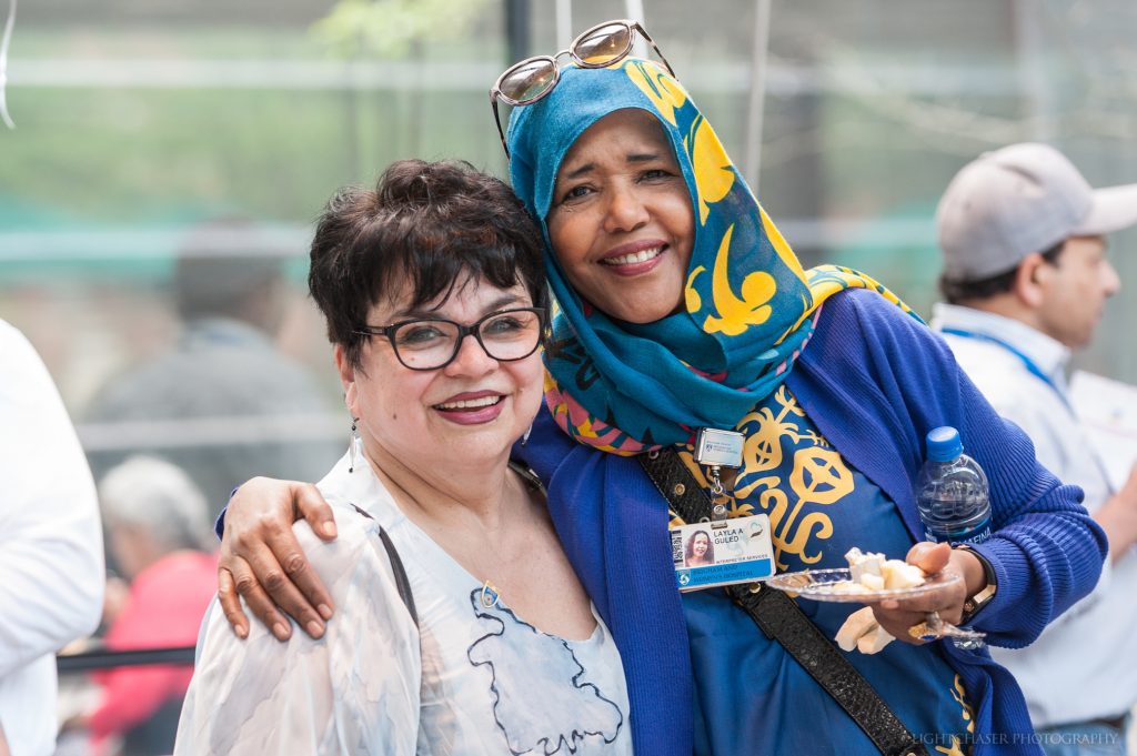 From left: Marta Solis and Layla Guled, both of Interpreter Services, celebrate Solis’ 45 years of service at the Brigham.