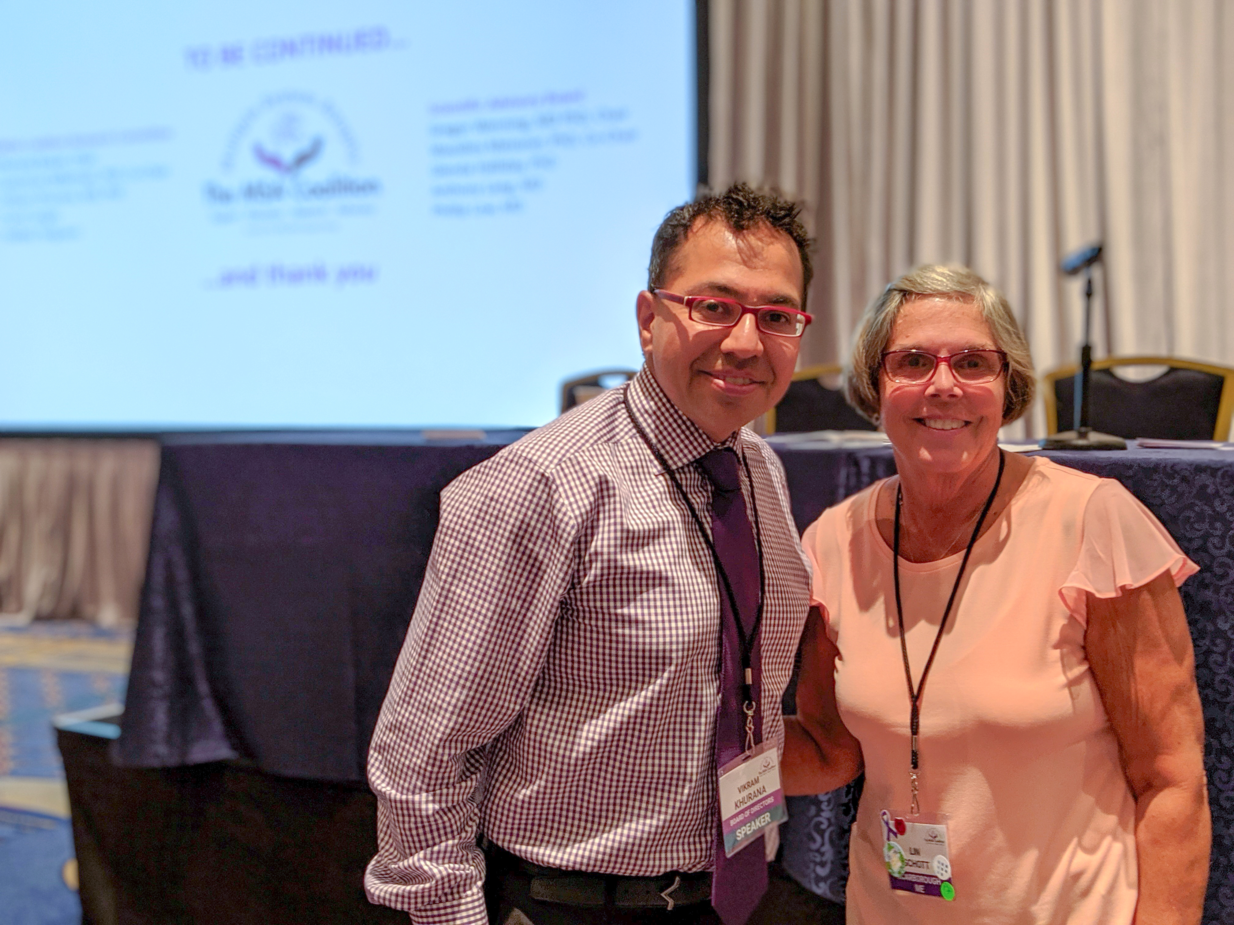 Doctor and patient stand together 